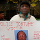 Aaron Cheney demonstrates outside the federal courthouse where former Chicago Police Cmdr. Jon Burge was attending a hearing on charges that he obstructed justice and committed perjury for lying while under oath during a 2003 civil trial about Chicago-police torture allegations Oct. 27, 2008, in Chicago.
Scott Olson/Getty Images